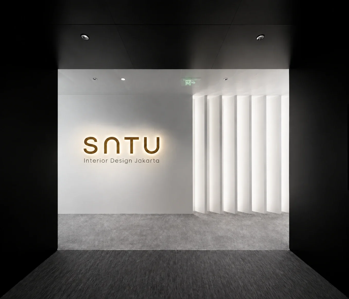 SATU Interior Design Jakarta — illuminated reception signage